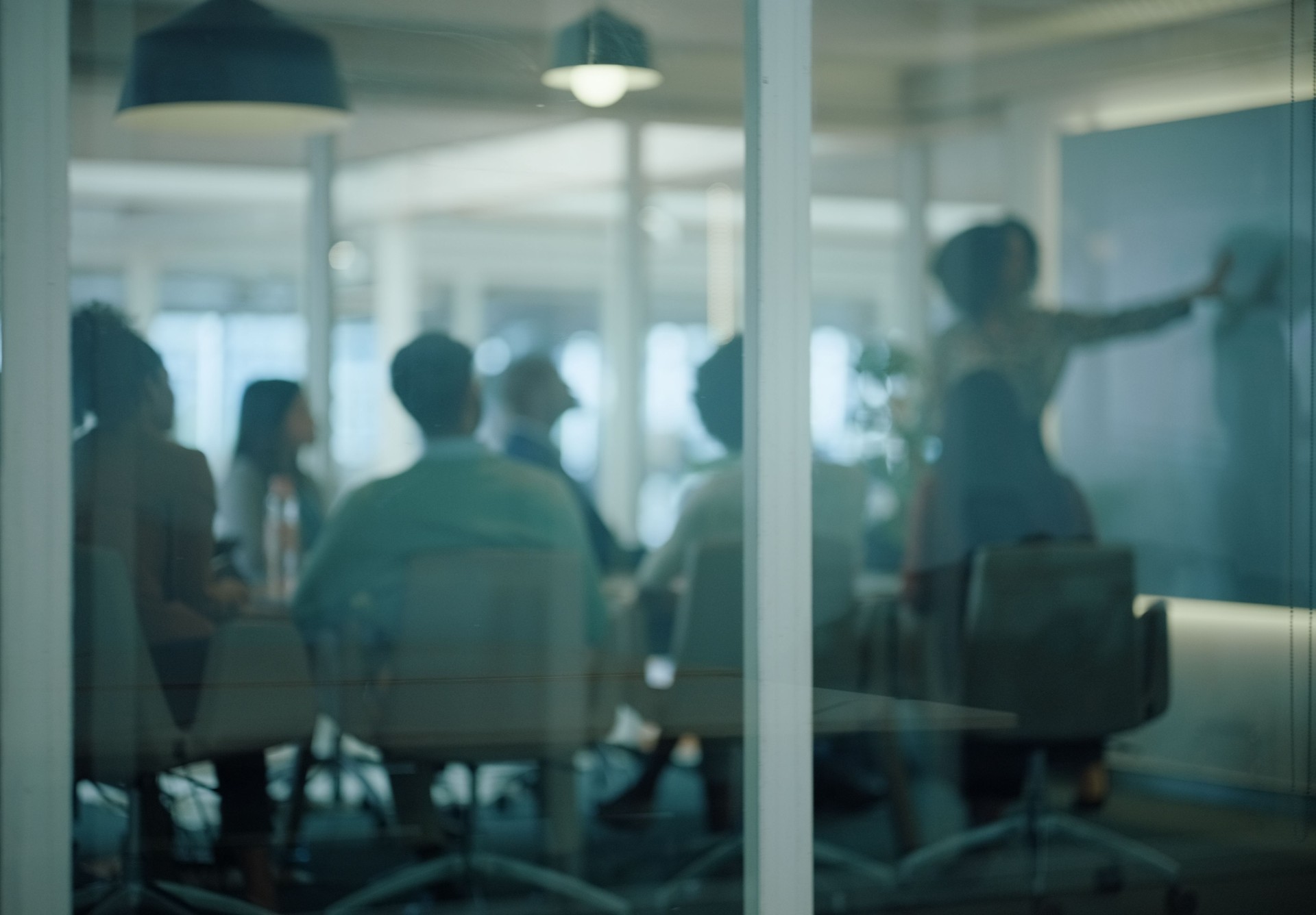 People, boardroom and glass for workshop, presentation and training in modern office in France. Businesspeople, meeting and speaker for corporate, communication and announcement for company seminar